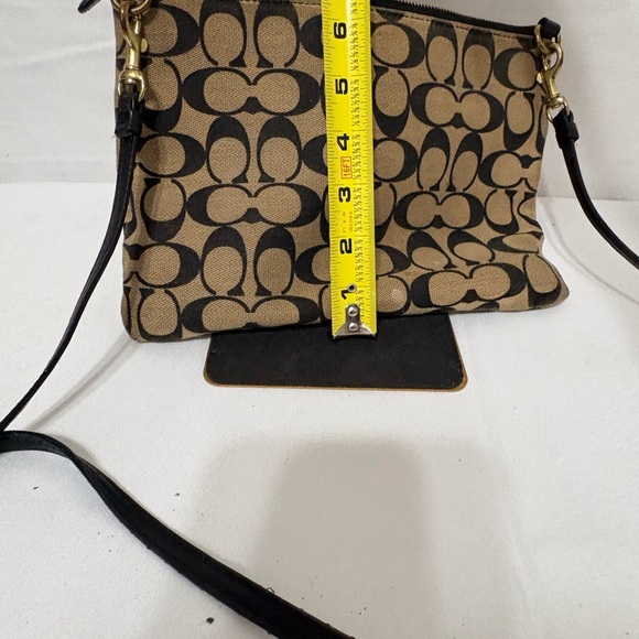 Canvas crossbody bag in khaki and black with a turnlock closure. - Picture 9 of 9